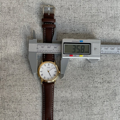 Reloj Citizen Quartz Hombre Marzo de 1990 Romano Clásico Dial Blanco