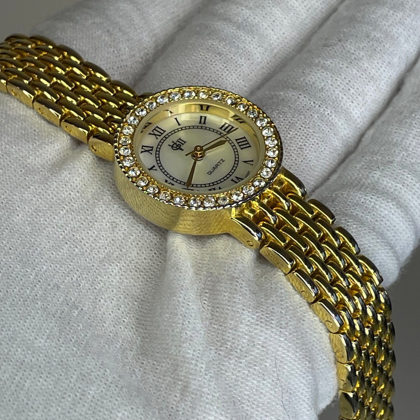 Reloj Joya Gloria Vanderbilt GV II Año 1995 aprox. NOS Dorado Bisel de cristales Neoclásico