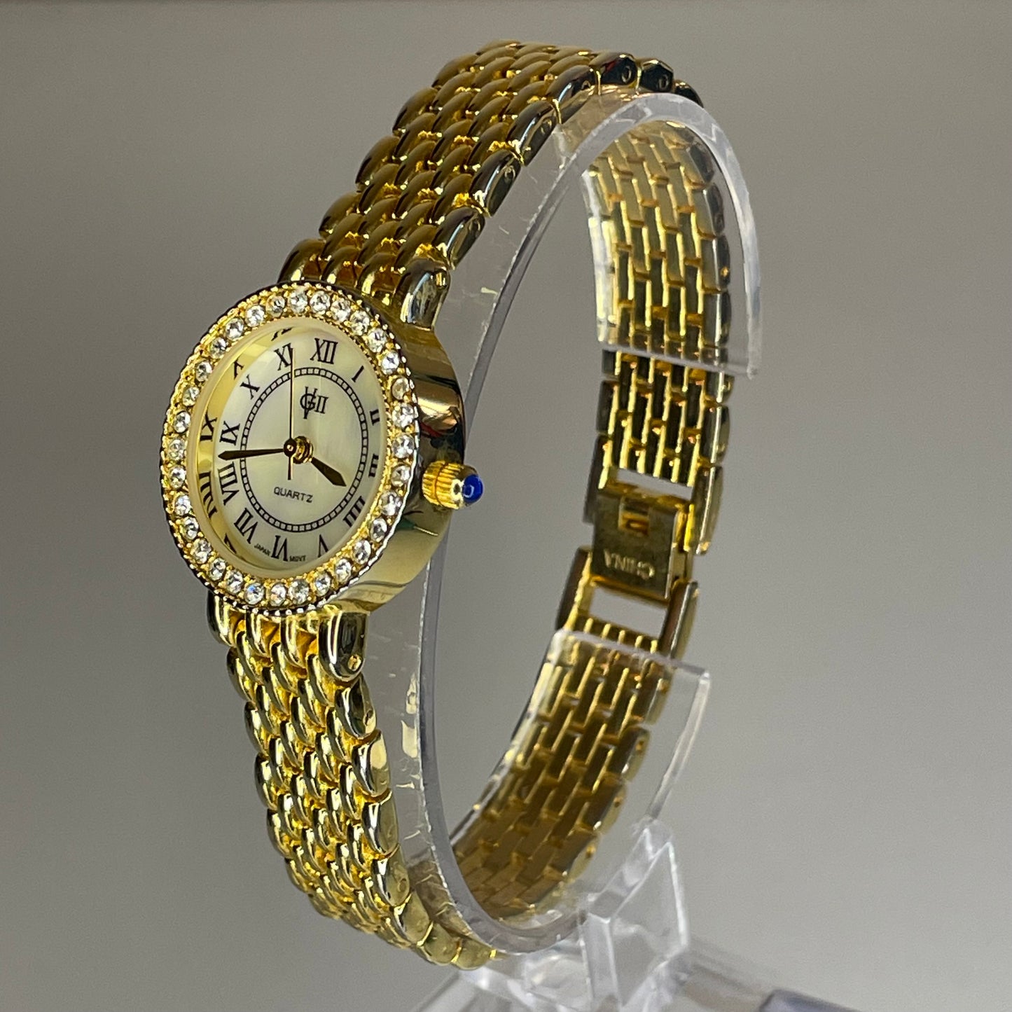 Reloj Joya Gloria Vanderbilt GV II Año 1995 aprox. NOS Dorado Bisel de cristales Neoclásico