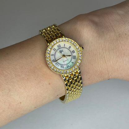 Reloj Joya Gloria Vanderbilt GV II Año 1995 aprox. NOS Dorado Bisel de cristales Neoclásico
