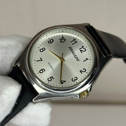 Reloj Brigade Hombre Elab. en 1999 Dial gris sunburst / Agujas doradas / Correa Nueva