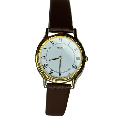 Seiko Quartz V700-6091 — vista frontal, fondo transparente
