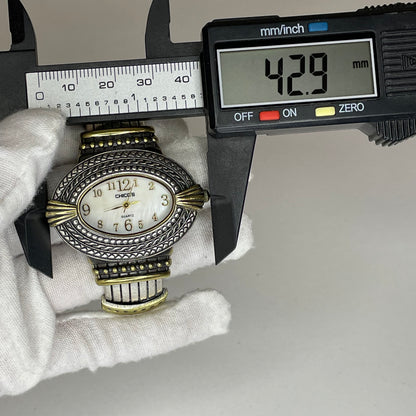 Reloj Joya Chico’s ovalado bicolor / brazalete ornamental Año 2005 Estética Bohemia y Western